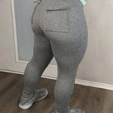Slayr Pantalones largos informales de moda callejera para mujer con ajuste cenido, bolsillos traseros y aberturas en el dobladillo, color gris