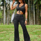 EZwear Conjunto verano ajustado compuesto por top corto negro y blanco con estampado de lunares, con cordon en la parte delantera y pantalones negros acampanados de ajuste cenido