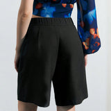 Maija Shorts de pierna ancha de unicolor para mujeres, adecuados para trabajar o usar como ropa casual