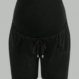 Pantalones cortos de maternidad de color liso con bolsillos y cordon