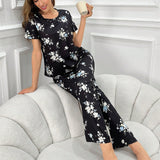 Conjunto de pijama para mujeres con estampado floral completo, manga corta y pantalon largo de moda