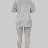 Slayr Conjunto de camiseta de manga corta y leggings para mujeres con estampado de eslogan de calavera y corazon