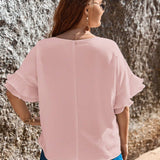 Camisa holgada para mujeres con a grande, cuello redondo y manga murcielago en unicolor para verano