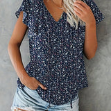 Nueva blusa casual de estilo vacacional para mujeres con cuello en V con estampado floral al azar y ribete de volantes