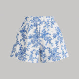 MOD Conjunto de top corto de hombros descubiertos impreso en azul y blanco con lazos en los hombros y shorts