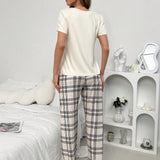 Conjunto de pijama de pantalon de cuadros estampados y top de manga corta con corazones y letras impresas en unicolor
