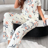 Conjunto de pijama de pantalon largo decorado con lazo y con estampado floral en la parte superior de manga corta