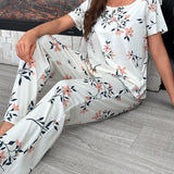 Conjunto de pijama de pantalon largo decorado con lazo y con estampado floral en la parte superior de manga corta