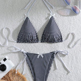 Swim Mod Conjunto de bikini de cuadros con cuello halter para mujer con decoración de lazo, traje de baño de dos piezas para vacaciones en la playa (estampado aleatorio)