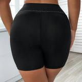 Pantalones cortos deportivos de talla grande con logo reflectante simple y estilo "booty shorts" (cortos ajustados)