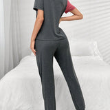 Conjunto de pijama deportivo de camiConjuntoa de manga corta con letras y pantalon de bloque de color