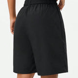 Coolane Shorts estilo callejero para mujer con ajuste holgado, longitud de la rodilla, tachuelas y tonos neutros