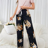 Conjunto de pijama de mujer con camiConjuntoa de manga corta de unicolor y pantalones cortos estampados de flores