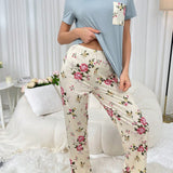 Conjunto de pijama de manga corta con estampado floral y pantalones largos con bolsillos