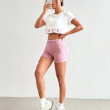 Sport Easify Conjunto de ropa deportiva informal para mujeres con camiseta sin mangas impresa con letras y leggings cortos