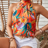 Parte superior de mujer con diseno floral, cuello halter y espalda descubierta para verano en la playa