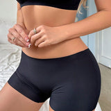 Pantalones cortos planos de cintura baja para mujer de unicolor