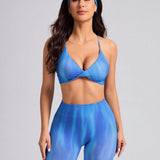 Sport Studio Conjunto deportivo ajustado para mujer de verano con top corto atado al cuello con diseno de torsion y pantalones cortos con estampado tenido y anudado en la cintura