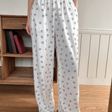 DAZY Pantalones de pijama con estampado de caras sonrientes en toda la prenda