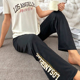 Conjunto de pijama deportivo elegante con camiConjuntoa de manga corta con cuello redondo y pantalones estampados con letras para mujer
