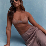 MISSGUIDED Top sin mangas con cuello de polo y mangas transparentes