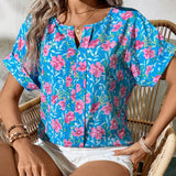 Camiseta de moda casual de verano con estampado floral azul y cuello en V