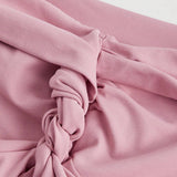 MOD Top corto de un solo hombro con detalle de nudo en color rosa