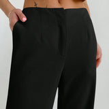 Aloruh Pantalones largos de cintura baja para mujer con bolsillos, diseno con botones ocultos, estilo de moda callejera simple