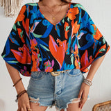 Blusa para mujer tejida suelta con estampado vacacional, cuello en V y mangas murcielago