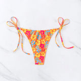 Fondo de bikini con estampado floral en toda la prenda y lazos a los lados para playa de verano (estampado aleatorio)