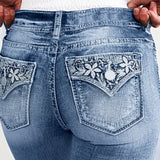 Jeans ajustados de moda para mujeres con bordado de flores en los bolsillos traseros