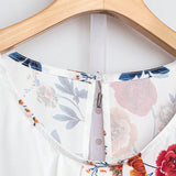 Blusa estampada floral en a grande con mangas de petalos