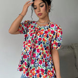 Blusa de manga abullonada con estampado floral y cuello de lazo