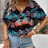 Blusa de manga murcielago con estampado tropical