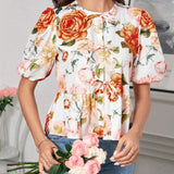 Blusa de cuello redondo con mangas gigot y textura de patron floral de tela