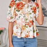 Blusa de cuello redondo con mangas gigot y textura de patron floral de tela