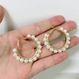 Pendientes largos con perla artificial