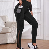 Yoga Trendy Leggings deportivos de malla en contraste con bolsillo de celular