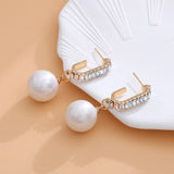 Pendientes largos con diseno de diamante de imitacion con perla artificial