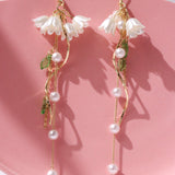 Pendientes largos con perla artificial & con diseno de flor