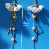 Pendientes largos con perla artificial & con diseno de flor