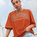 Naranja Quemada / S Camiseta de hombros caídos con estampado de letra