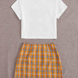 Multicolor / S Conjunto camiseta corta con estampado de dibujo con falda de tartán con abertura M