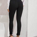 Negro / S Jeans ajustados de cintura alta con lavado negro