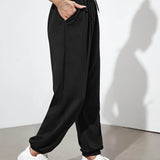 Negro / XL Pantalones deportivos con cordón con bolsillos oblicuos unicolor