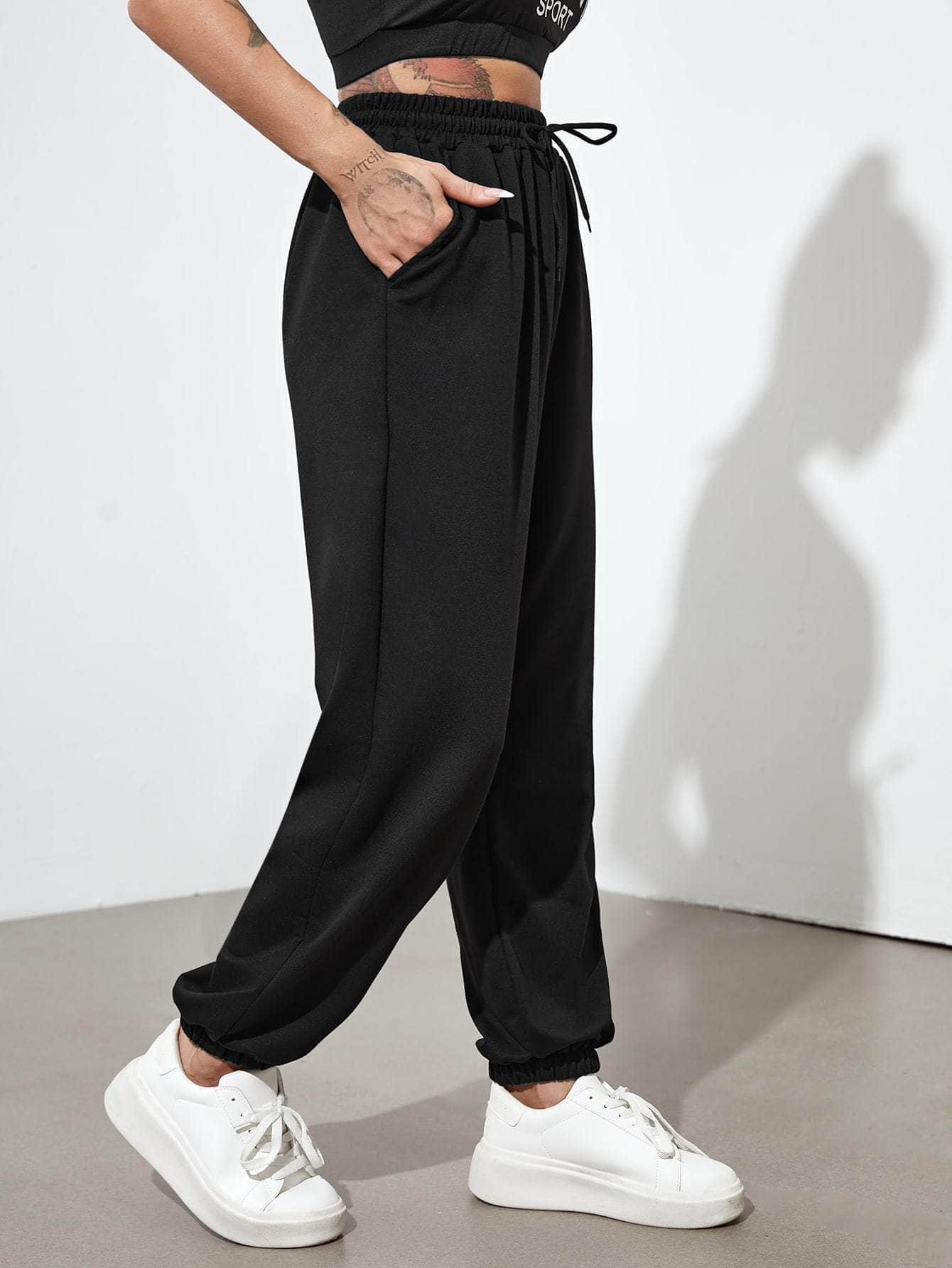 Negro / XL Pantalones deportivos con cordón con bolsillos oblicuos unicolor