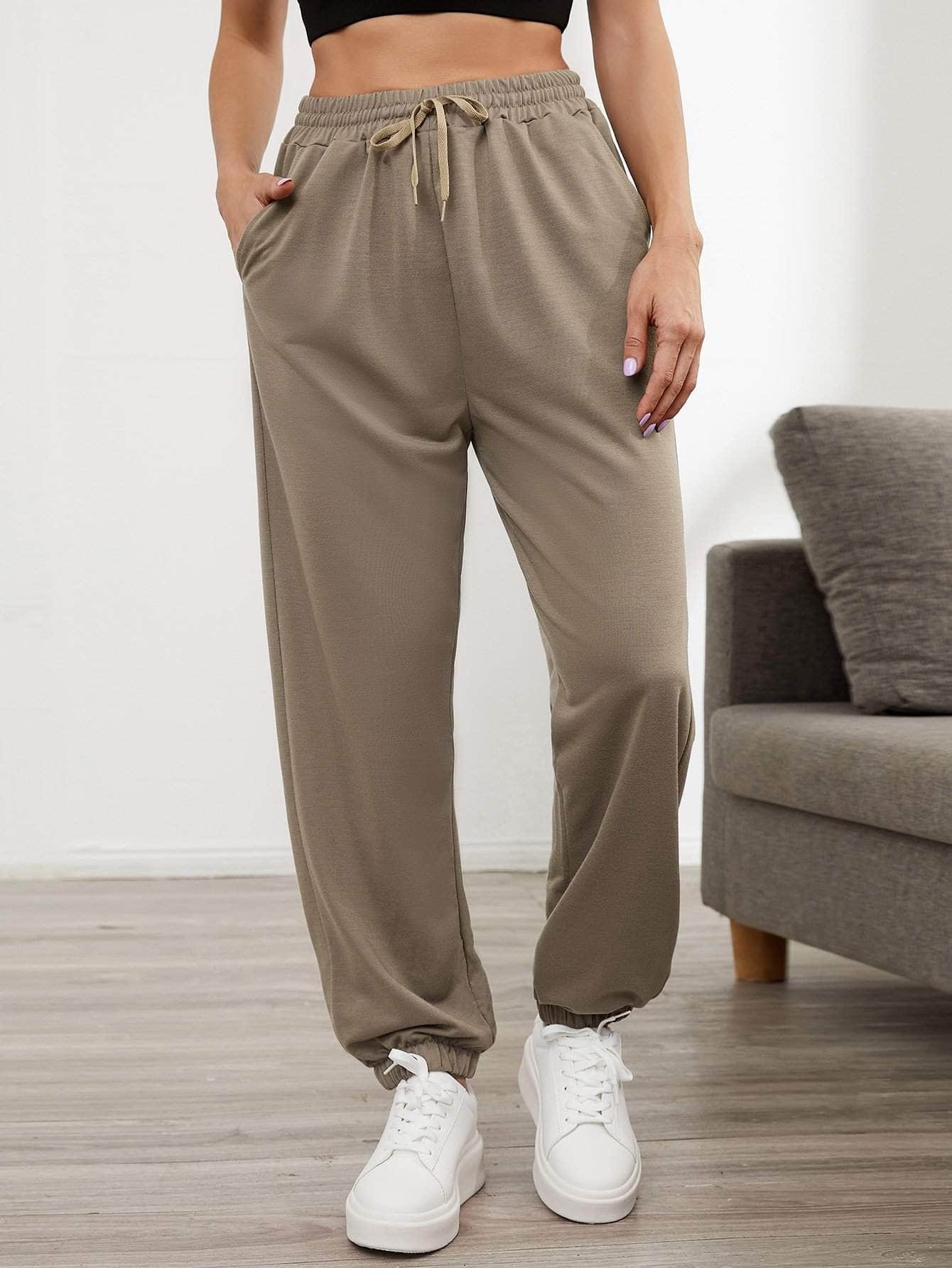 Pantalones deportivos con cordón con bolsillos oblicuos unicolor