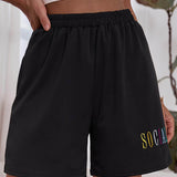 Negro / S Shorts track con bordado de letra